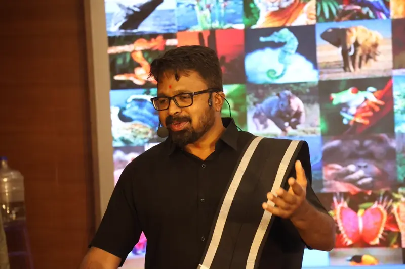 Guruji presenting with nature backdrop