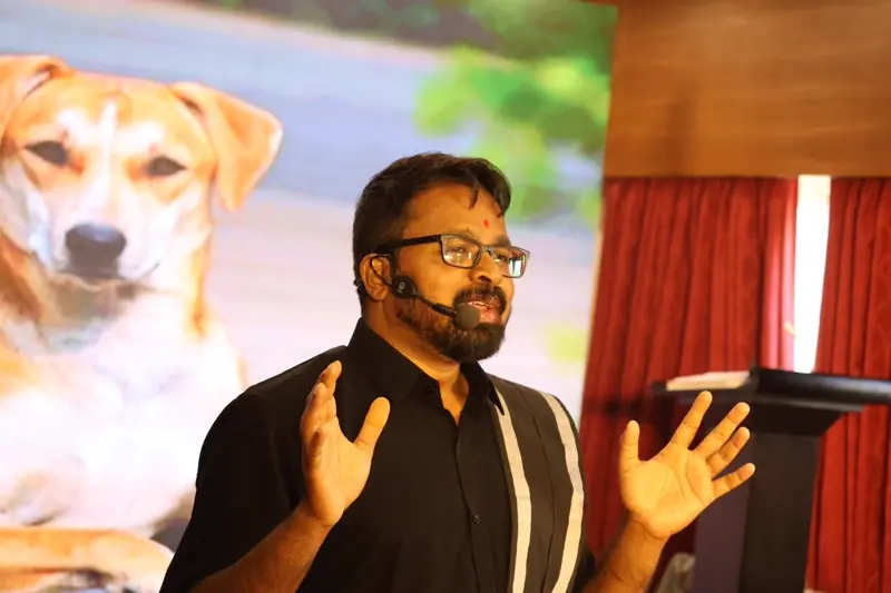 Guruji speaking passionately with both hands